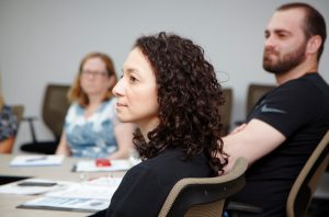 Adult Learners sitting in the classroom listening to the lecture