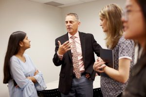 Adult learners having a conversation with the instructor